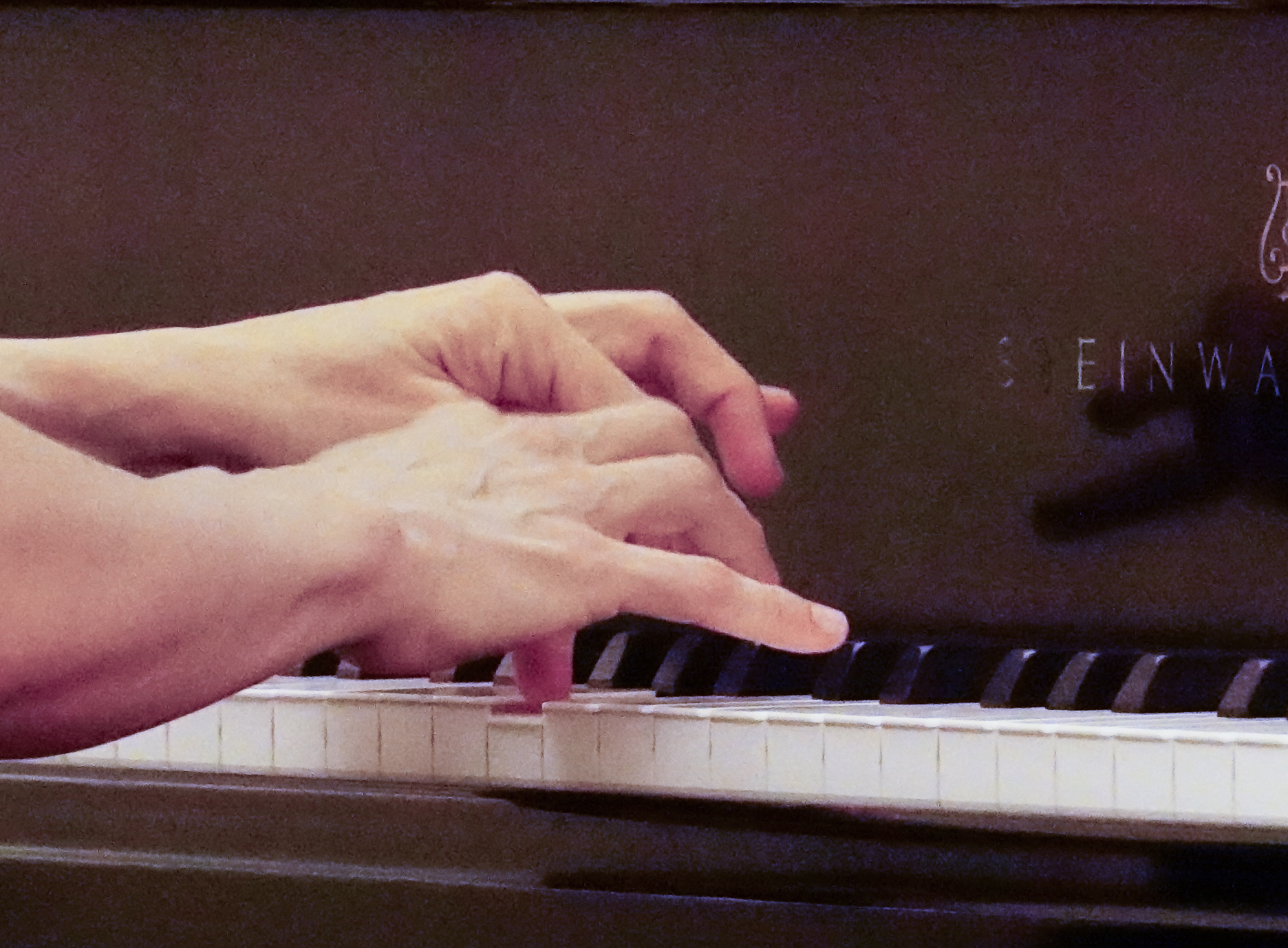 A pianist's hands at the keyboard during a WIPAC competition